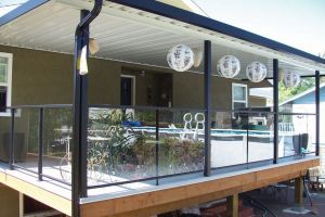 Vinyl Deck with Aluminum Patio Cover, and Glass Deck Railings