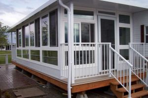 Customized Sunroom with Aluminum Picket Railings by Castle Decks