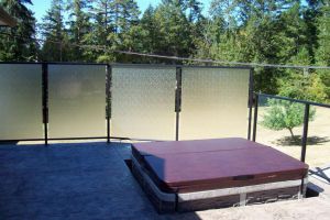 Opaque glass privacy railing by Castle Decks & Aluminum Products.